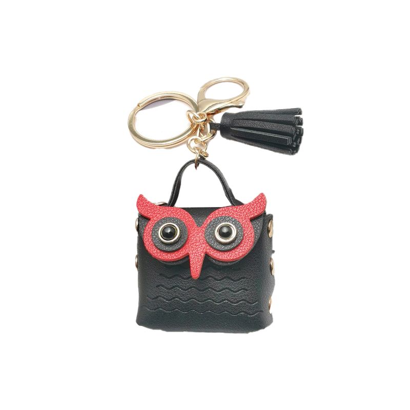 Mini keychain owl in a small pouch