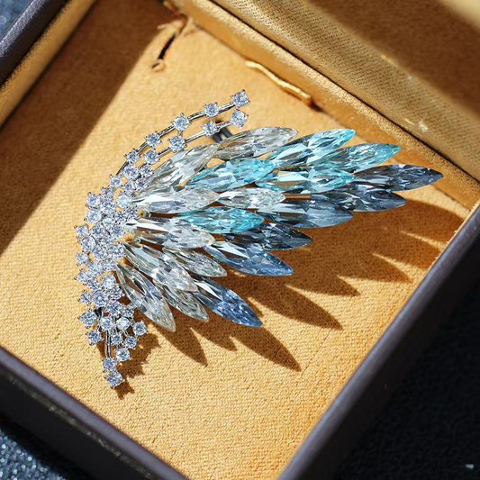 Half-butterfly brooch with elegant gradient crystal design; fashionable insect-shaped brooch with gold plating.