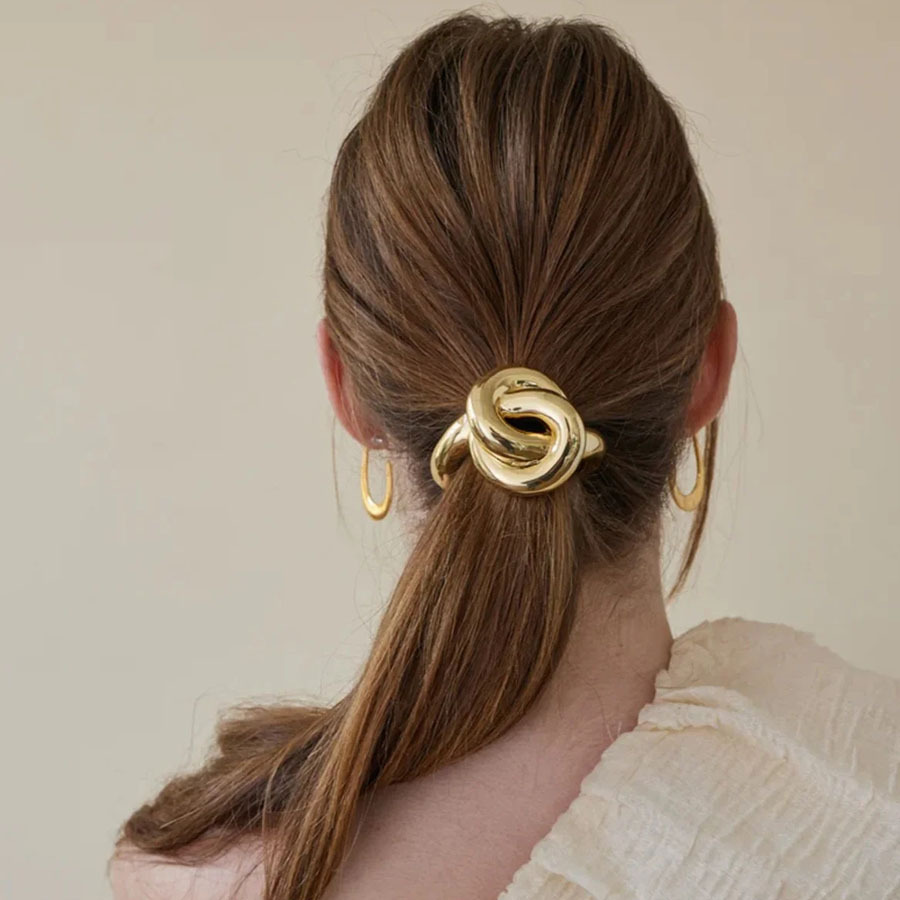 Designer metal hair tie with knot, simple and versatile hair band for women to tie ponytails and buns.