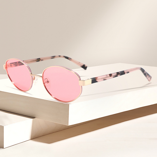 Women's stylish travel sunglasses with simple and versatile metal oval frames, UV protection, and polarized lenses.