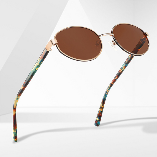 Women's stylish travel sunglasses with simple and versatile metal oval frames, UV protection, and polarized lenses.