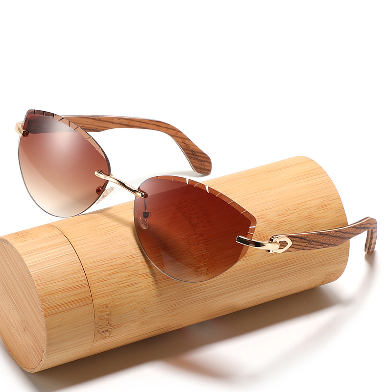 Frameless sunglasses, stylish cat-eye design, lenses cut with wood-paneled temples.