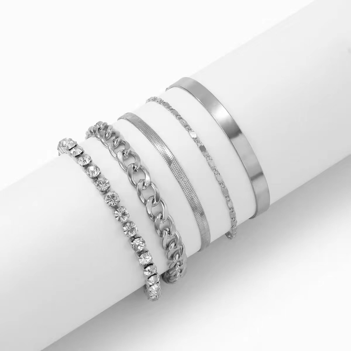 Punk-style, minimalist, and versatile bracelet set – geometric designs with diamond inlays, creating a cool and multi-layered look.