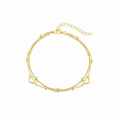 Double-layered, aloof in appearance, with bead-encrusted chains and an alloy heart-shaped bracelet