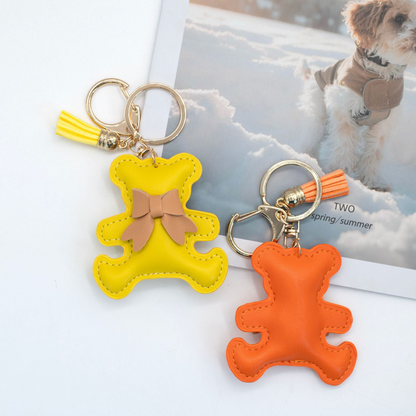 Ribbon-patterned, multicolored bear-shaped PU leather keychain with padded interior