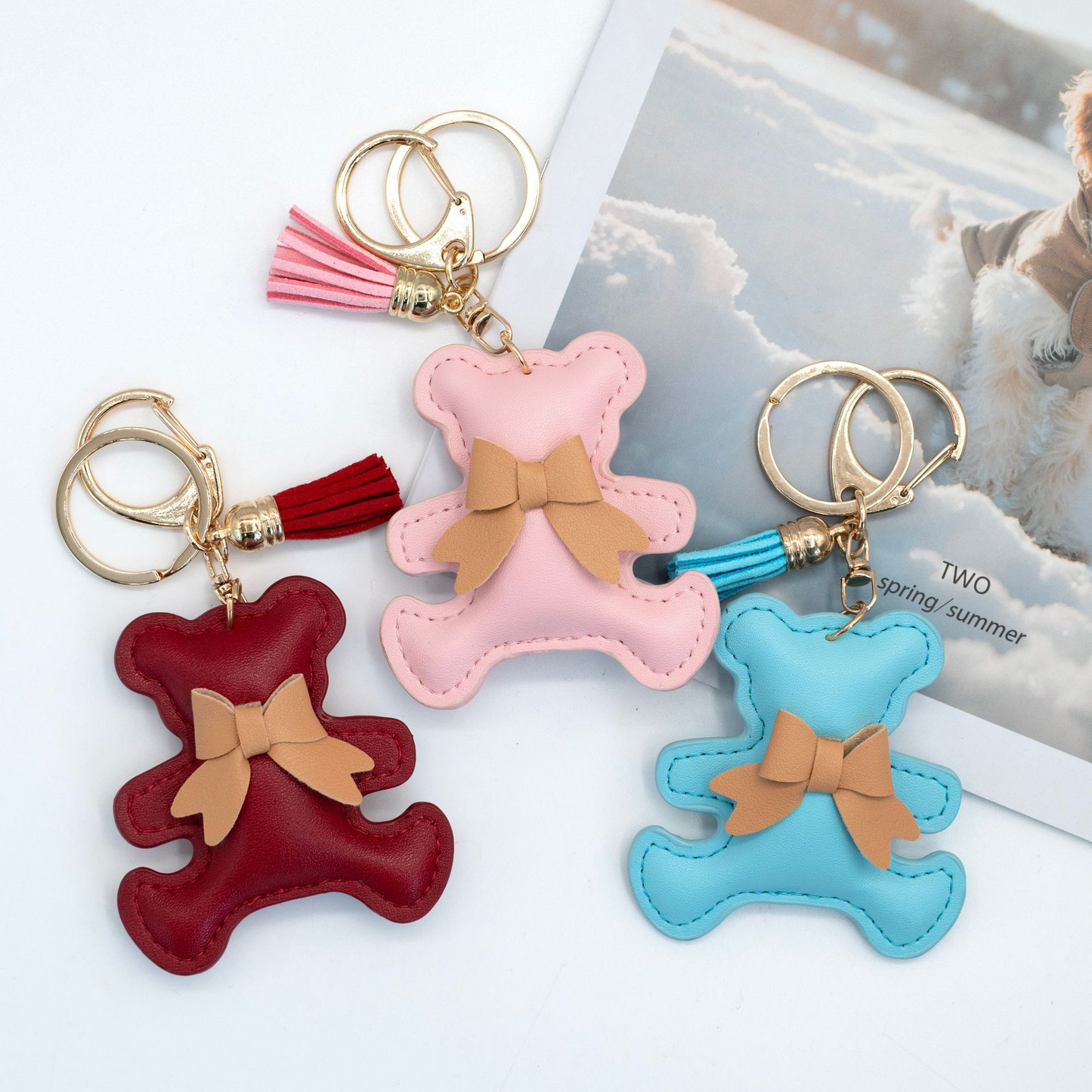 Ribbon-patterned, multicolored bear-shaped PU leather keychain with padded interior