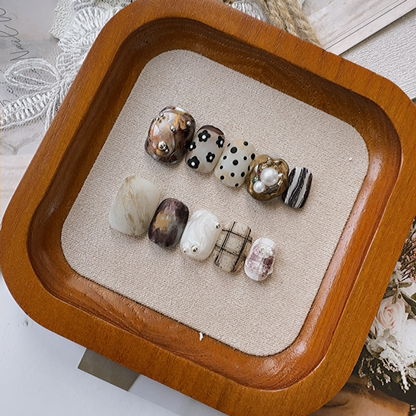 Artistic short-armored, matte, medieval-style nail set for wearing