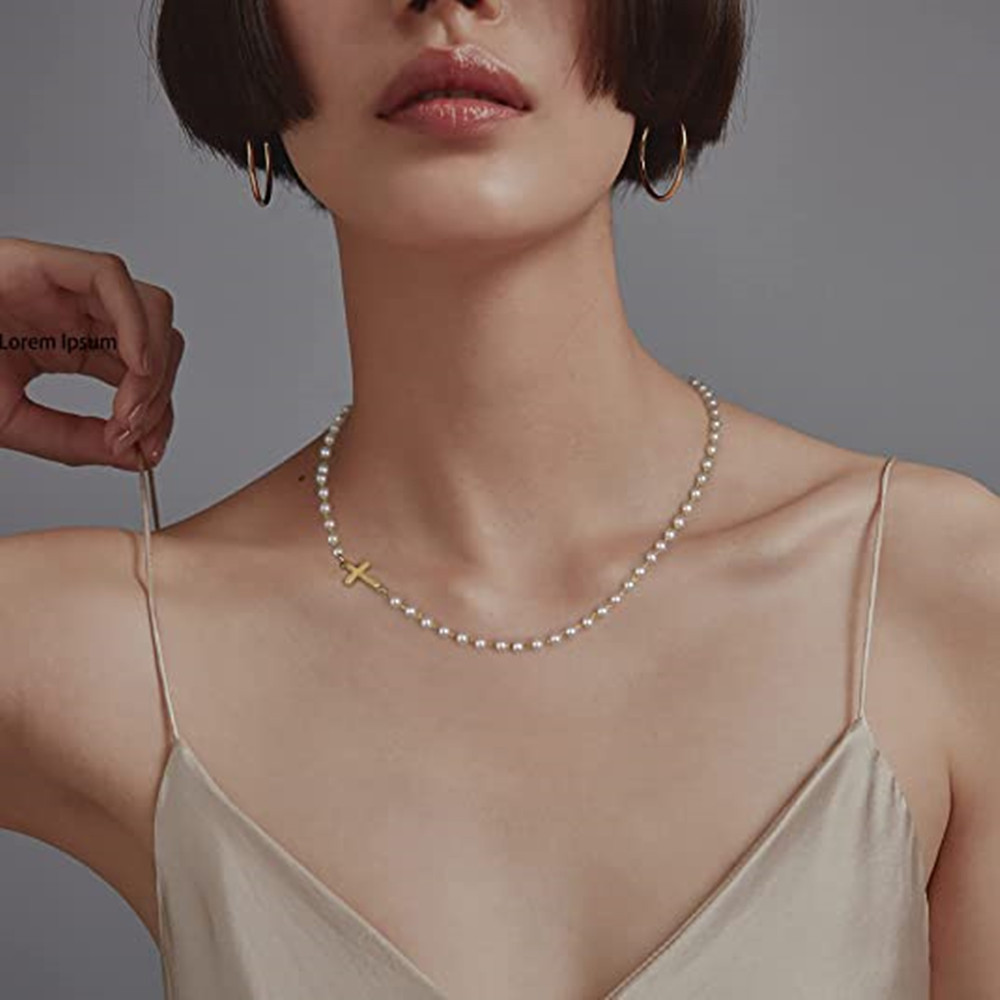 White pearl-inspired necklace, short collar chain for weddings, simple cross pendant – a stylish necklace accessory.