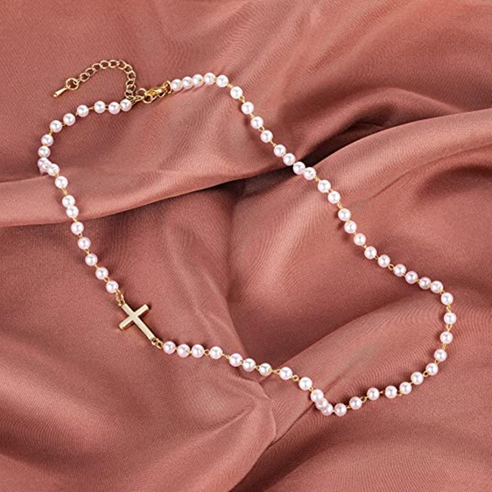 White pearl-inspired necklace, short collar chain for weddings, simple cross pendant – a stylish necklace accessory.