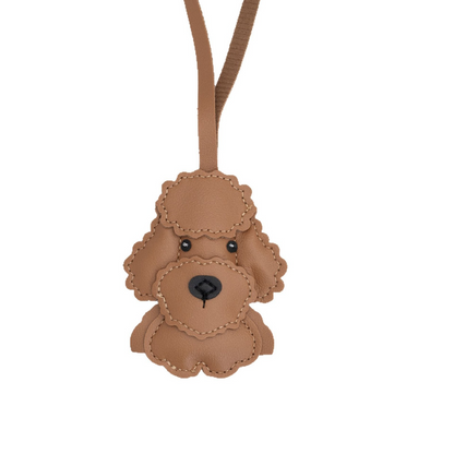 Cute cartoon-style leather bags and keychains in teddy bear design