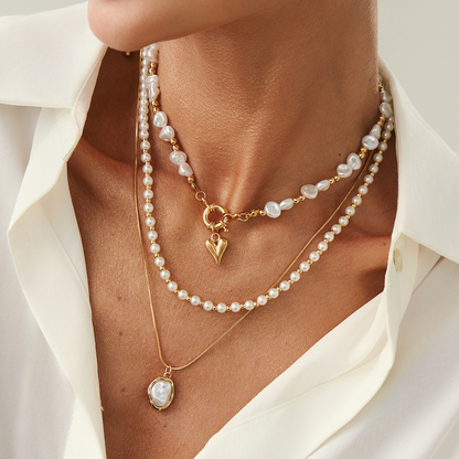 Fashionable multi-layer jewelry set with pearl-inspired heart-shaped pendants in a Baroque style – a luxurious and elegant women's necklace.