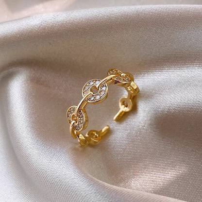 A trendy, small-scale design ring for women – an open-ring finger ring designed to be worn on the index finger, resembling a copper coin.