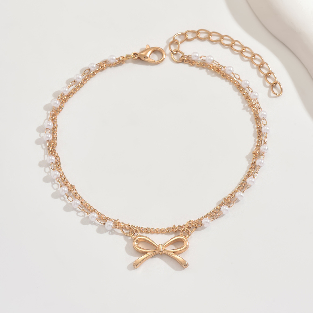 Pearl-inspired bow-shaped bead double-layer ankle chain