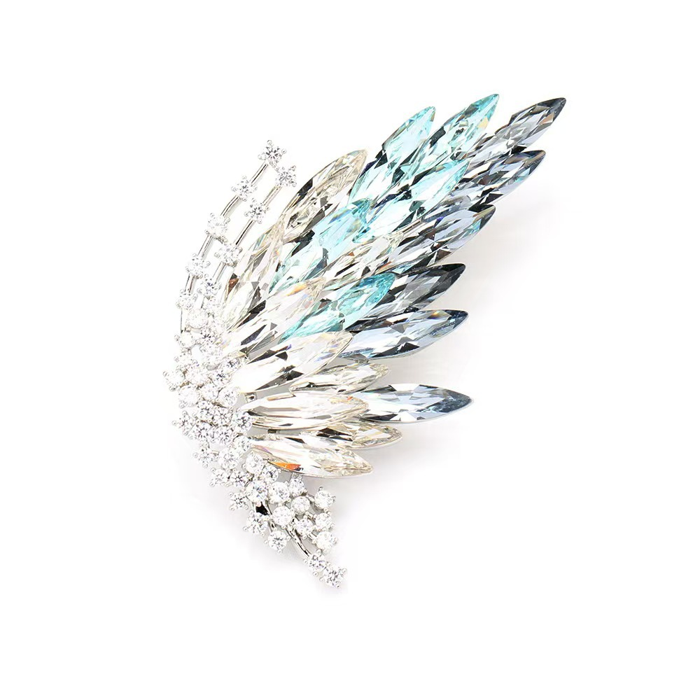 Half-butterfly brooch with elegant gradient crystal design; fashionable insect-shaped brooch with gold plating.
