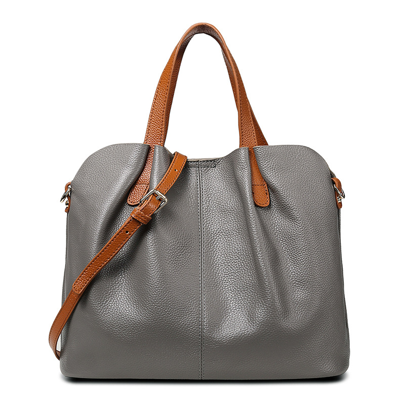 Durable, high-quality leather tote bag with large capacity; stylish women's bag made from top-quality cowhide in a contrasting color; a unique, slanted-style shoulder bag.