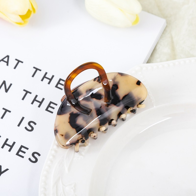 High-end acetate hair clip, shark clip at the back of a woman's head